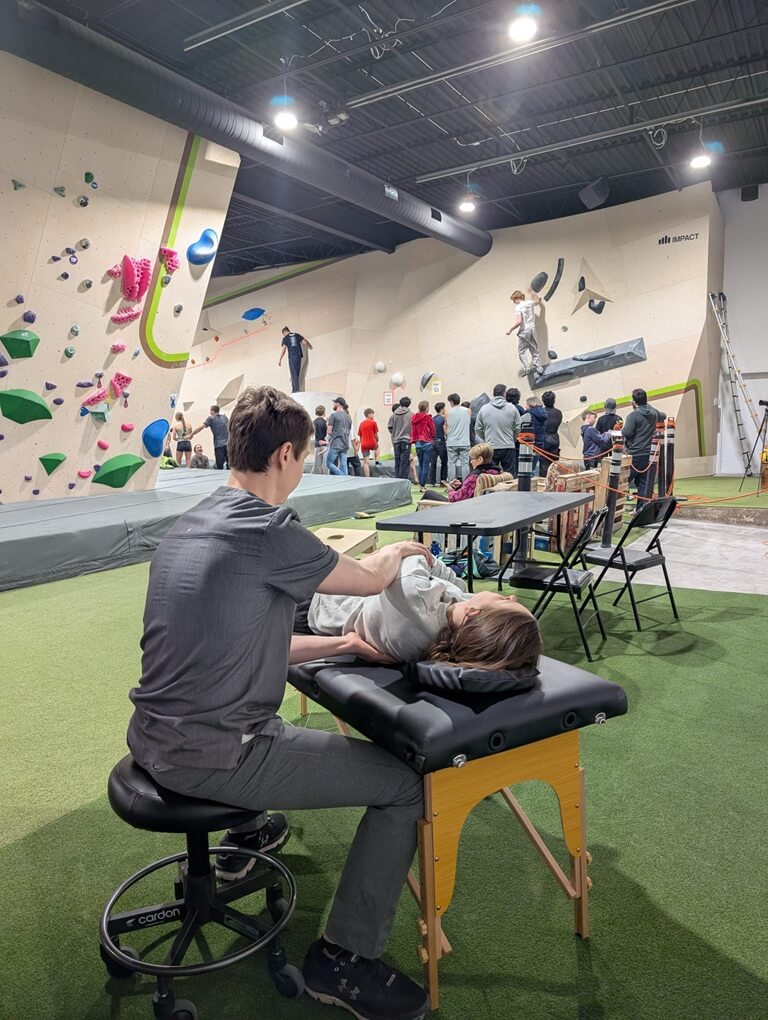 Kostya Strilets performing osteopathic therapy on an athlete at Osteo Difference clinic in Milton Ontario